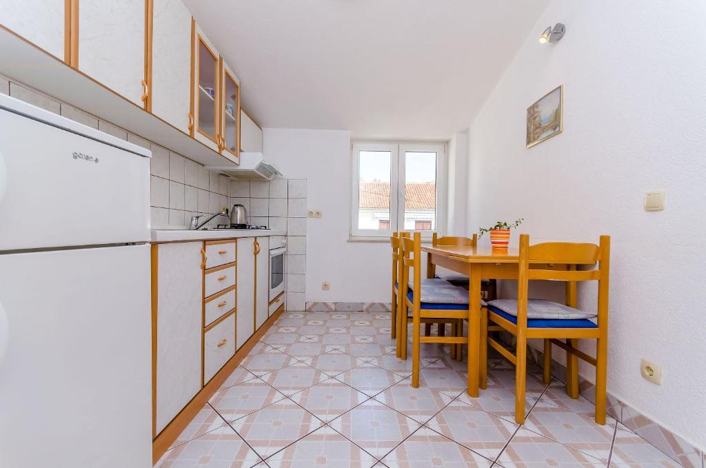 Kuchyň nebo kuchyňský kout v ubytování Apartments Tily