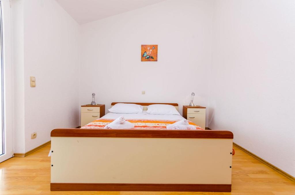 Postel nebo postele na pokoji v ubytování Apartments Tily