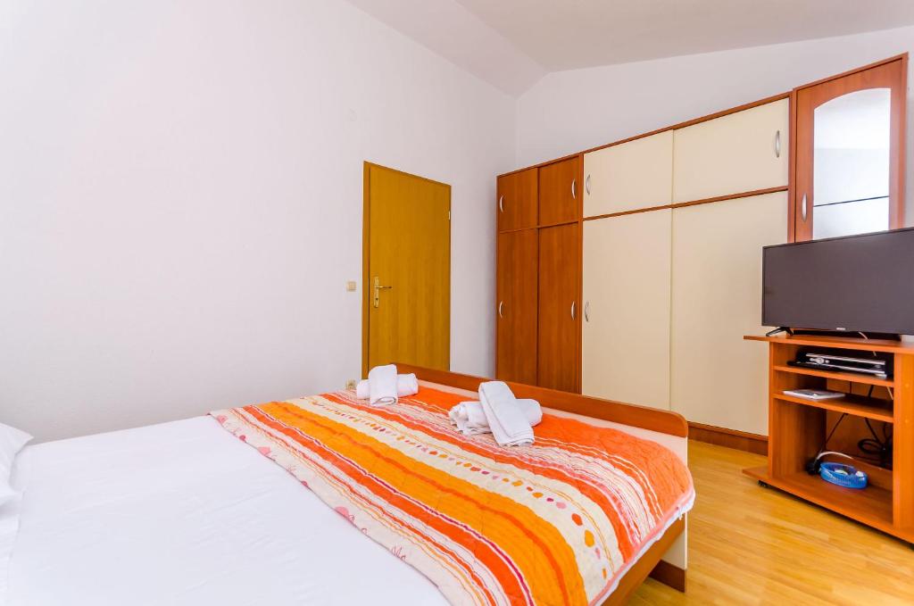 Postel nebo postele na pokoji v ubytování Apartments Tily