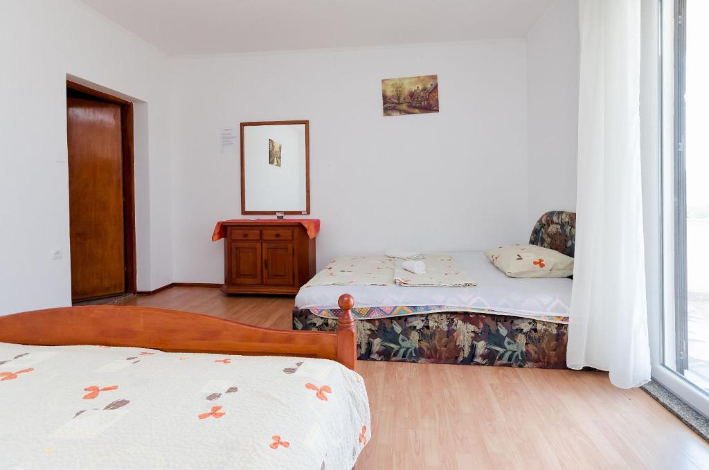 Postel nebo postele na pokoji v ubytování Apartments Danica