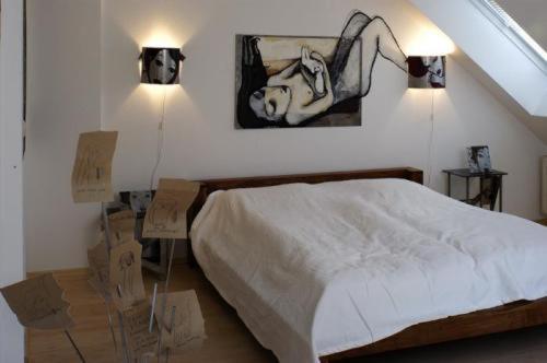 Postel nebo postele na pokoji v ubytování Arthotel Landhaus Zur Alten Gärtnerei