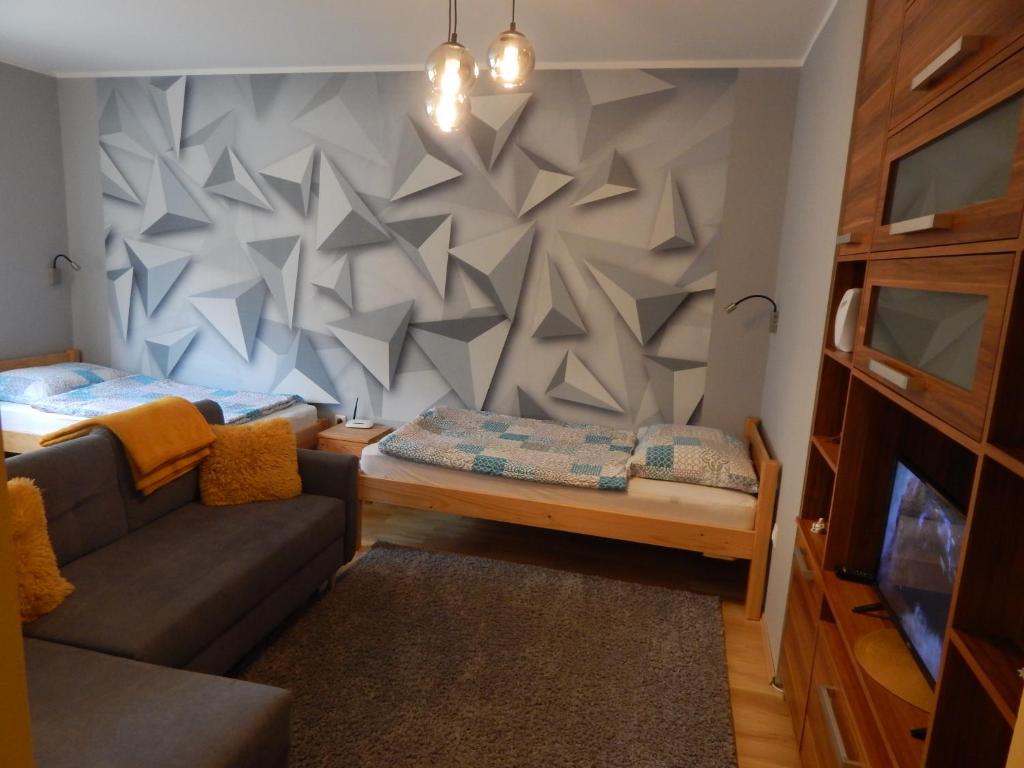 Posteľ alebo postele v izbe v ubytovaní Boros Apartman