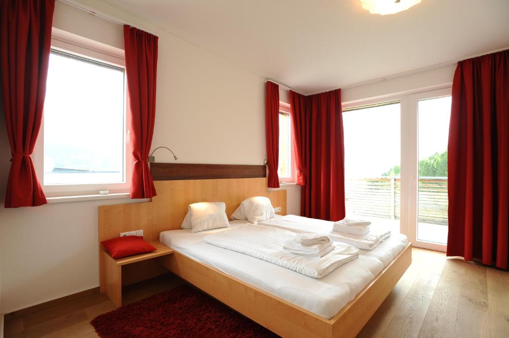 En eller flere senge i et værelse på Penthouse Alpine Living direkt an der Skipiste by Schladmingurlaub