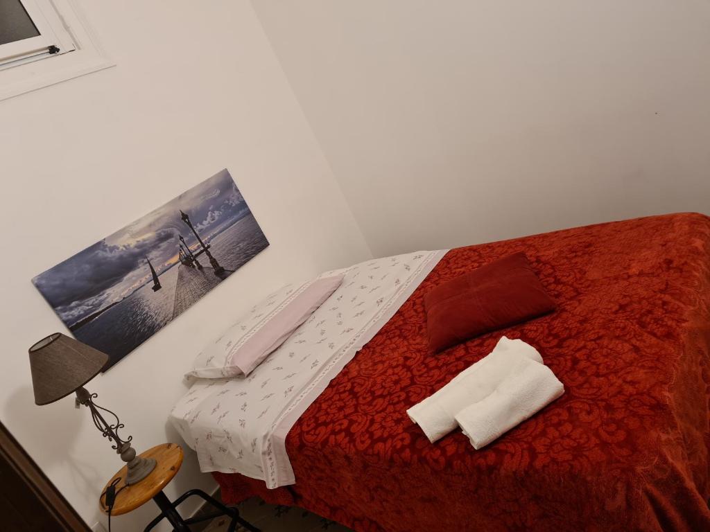 Posteľ alebo postele v izbe v ubytovaní Agorà Sant’anna Apartment
