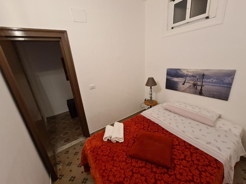 Posteľ alebo postele v izbe v ubytovaní Agorà Sant’anna Apartment