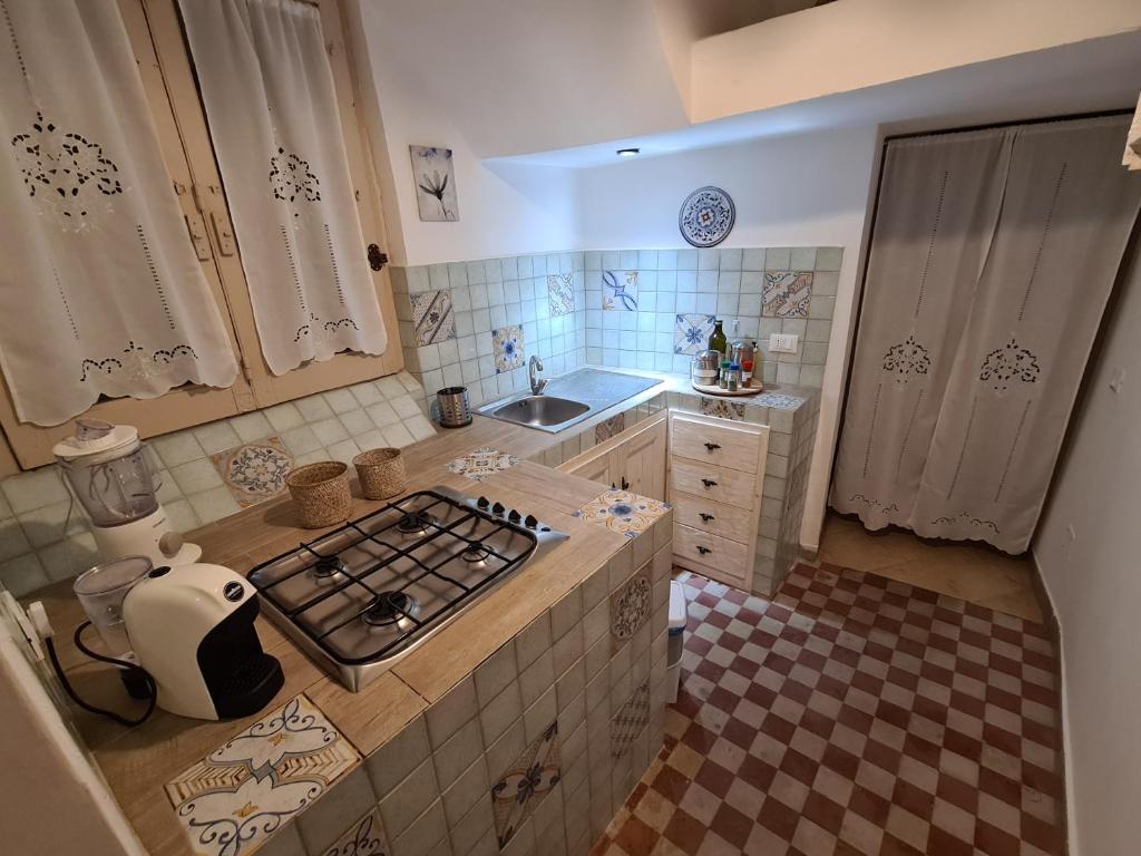 Kuchyňa alebo kuchynka v ubytovaní Agorà Sant’anna Apartment
