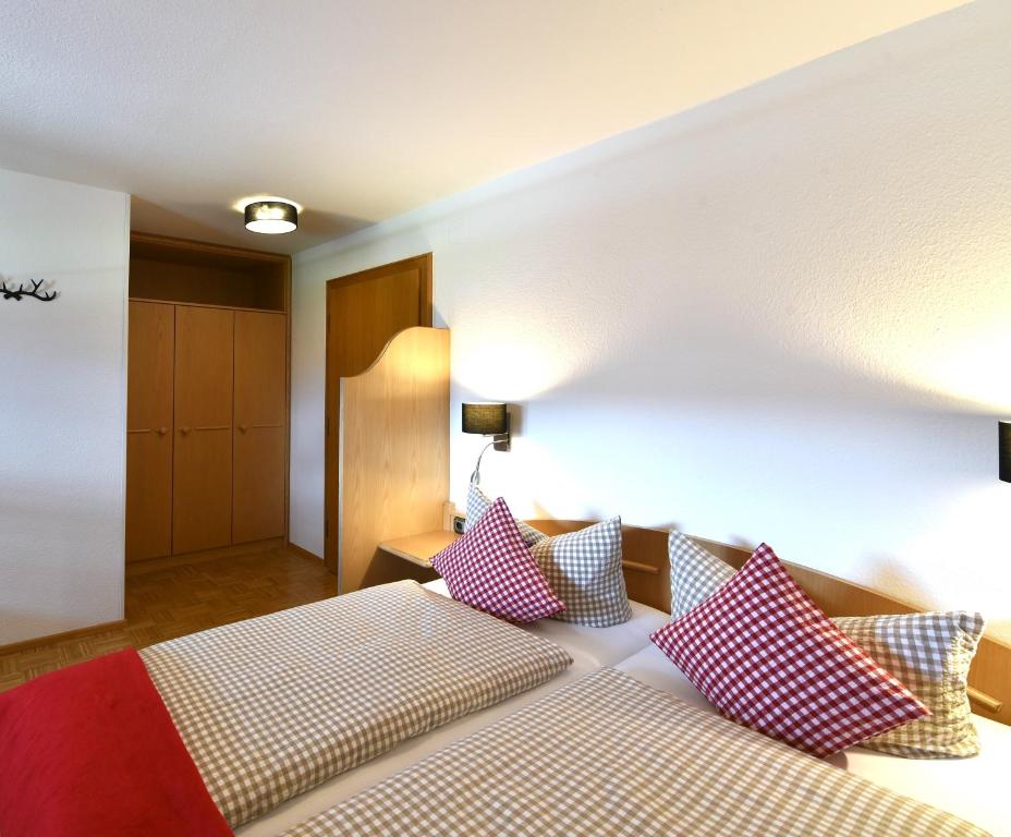 Postel nebo postele na pokoji v ubytování Hotel AlpIn Bed & Breakfast
