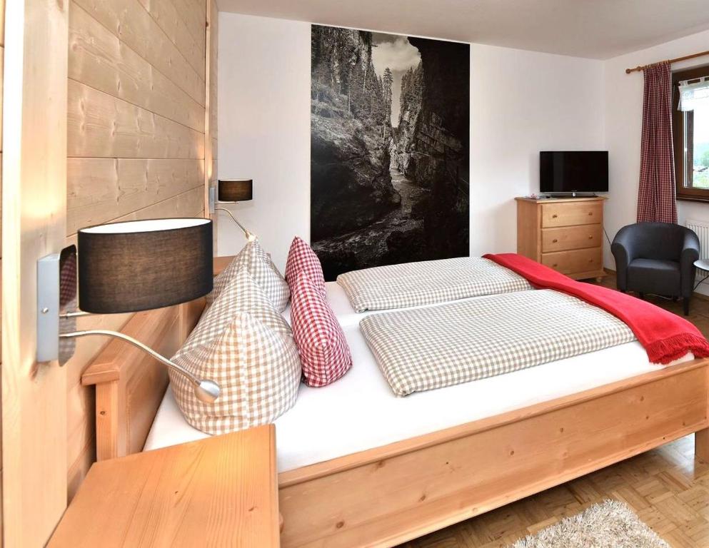 Postel nebo postele na pokoji v ubytování Hotel AlpIn Bed & Breakfast