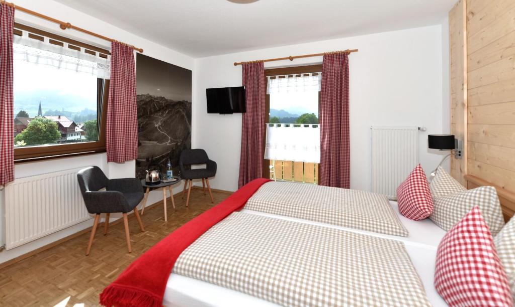 Postel nebo postele na pokoji v ubytování Hotel AlpIn Bed & Breakfast