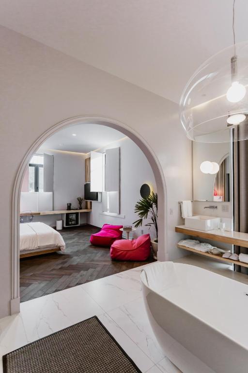 Postel nebo postele na pokoji v ubytování Tá Hotel de diseño