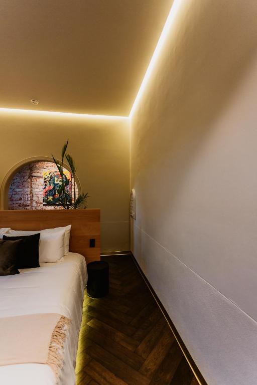 Postel nebo postele na pokoji v ubytování Tá Hotel de diseño