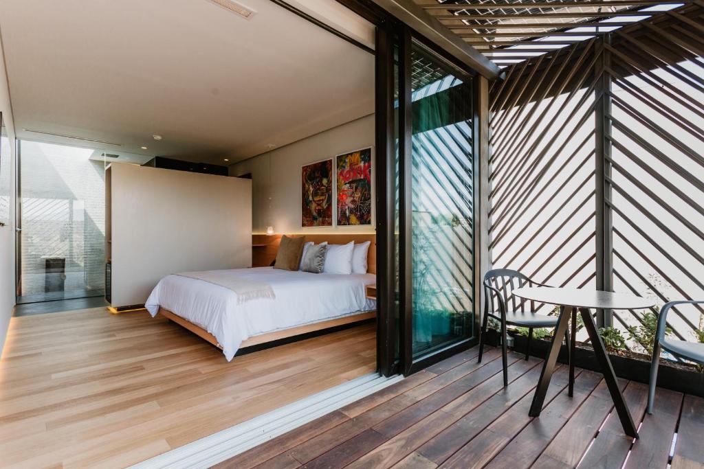 Postel nebo postele na pokoji v ubytování Tá Hotel de diseño