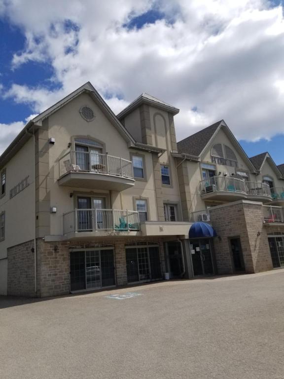 a large building with balconies on the side of it at Condo St Sauveur in Piedmont