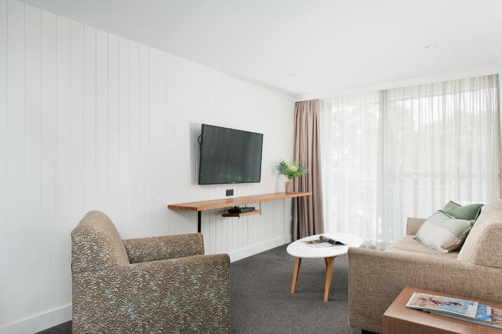 TV a/nebo společenská místnost v ubytování Hotel Nelson