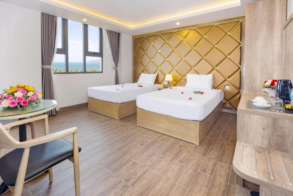 Postel nebo postele na pokoji v ubytování Azura Gold Hotel & Apartment