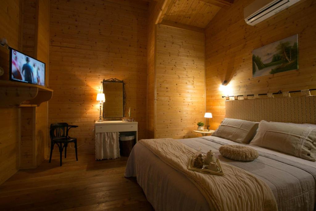 Tempat tidur dalam kamar di L'Anfora Country Club