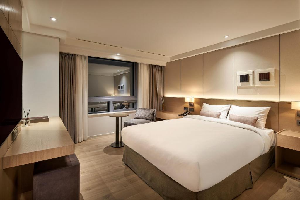Postel nebo postele na pokoji v ubytování Hotel Interburgo Exco