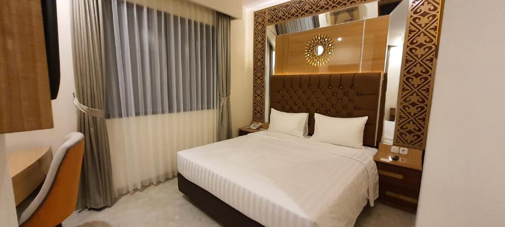 Postel nebo postele na pokoji v ubytování Hotel Daily Inn Bandung