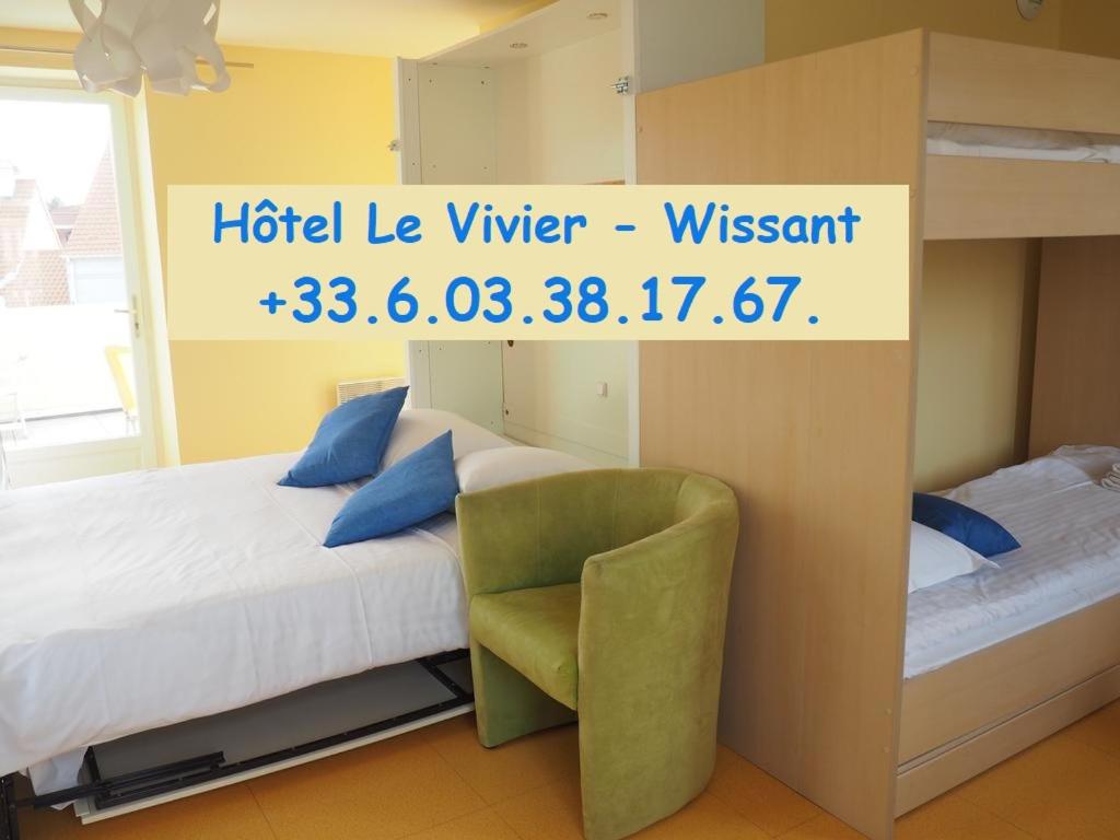 a bedroom with a bunk bed and a chair at Hôtel Le Vivier WISSANT - Centre Village - Côte d'Opale - Baie de Wissant - 2CAPS in Wissant