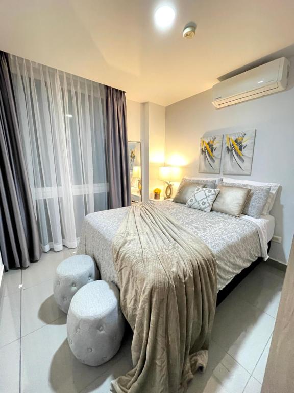 Łóżko lub łóżka w pokoju w obiekcie Acogedor Condominio de lujo Ejecutivo/familiar
