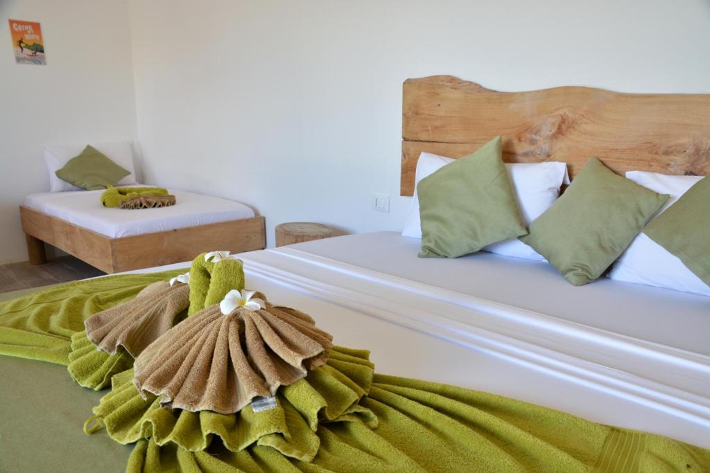 Postel nebo postele na pokoji v ubytování La Base Hotel