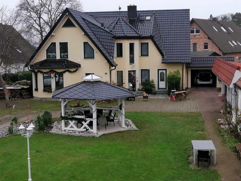 an aerial view of a house with a gazebo at FEWO Vermietung Carmen Sagner in Baabe