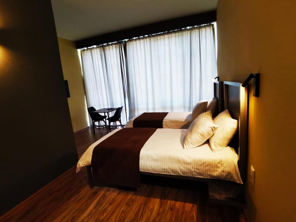 Postel nebo postele na pokoji v ubytování STARK HOTEL