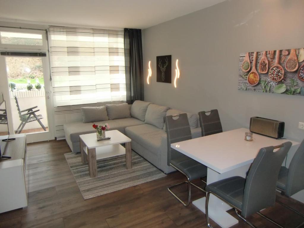 a living room with a couch and a table at Schickeria in Goslar