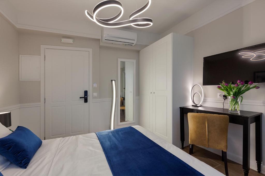 Posteľ alebo postele v izbe v ubytovaní Classic Hotel by Athens Prime Hotels