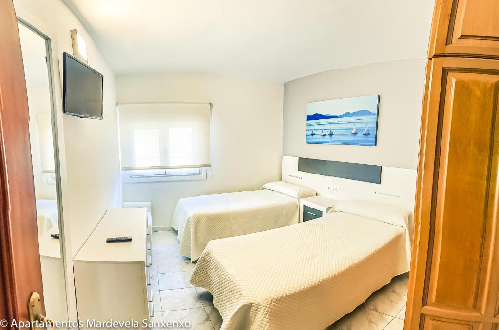 TV a/nebo společenská místnost v ubytování Apartamento Mardevela