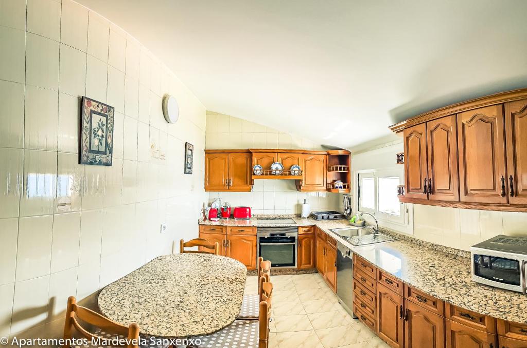 Kuchyň nebo kuchyňský kout v ubytování Apartamento Mardevela
