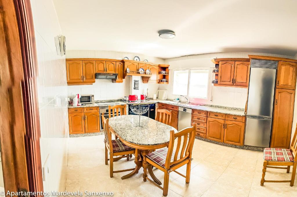 Kuchyň nebo kuchyňský kout v ubytování Apartamento Mardevela