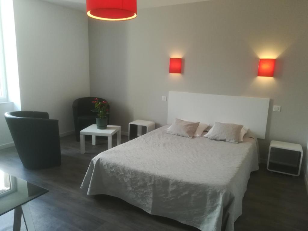 Postel nebo postele na pokoji v ubytování Le Relais de Ceilhes