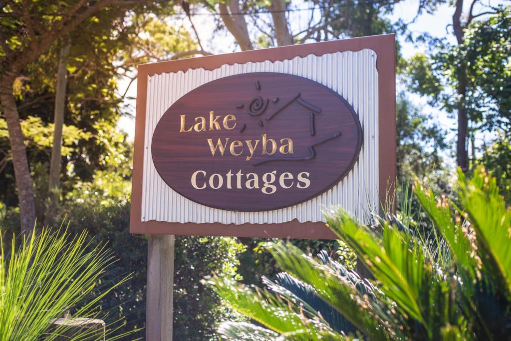 a sign for a lake wrexha coffees at Lake Weyba Cottages Noosa in Peregian Beach