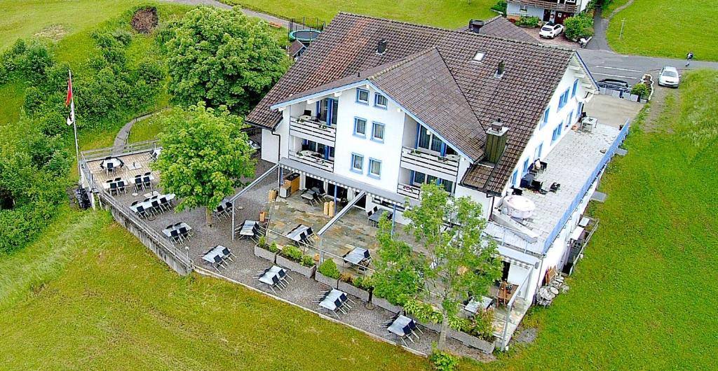 an aerial view of a large white house with a yard at Panorama Hotel Freudenberg in Appenzell