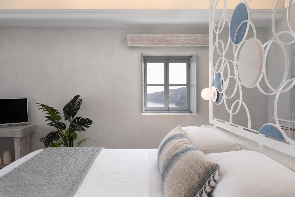 Voodi või voodid majutusasutuse Bubble Suite Santorini toas