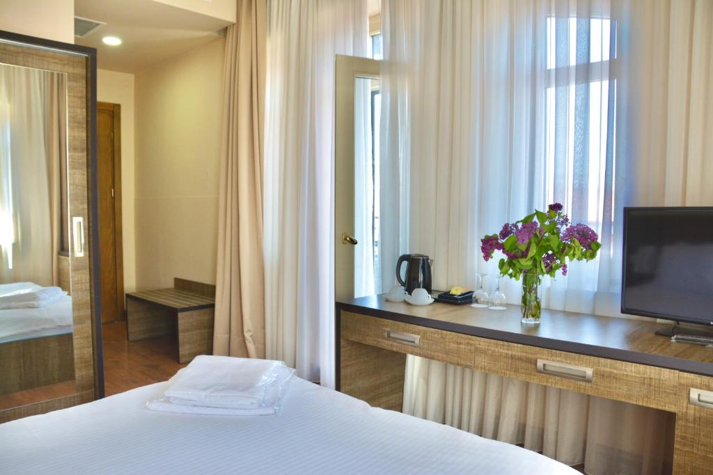 Rúm í herbergi á Boutique Hotel O. Galogre