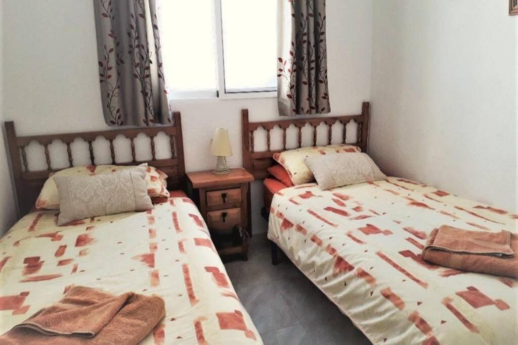 A bed or beds in a room at Beautiful Air Conditioned bungalow - Alkabir