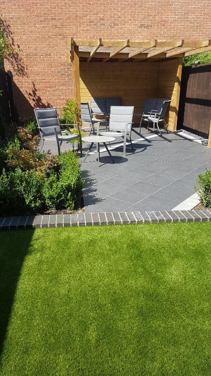 a group of chairs and tables on a patio at Rutland View in Oakham