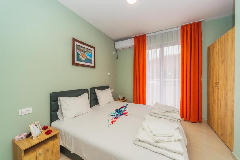 Postel nebo postele na pokoji v ubytování ApartHotel Solaris