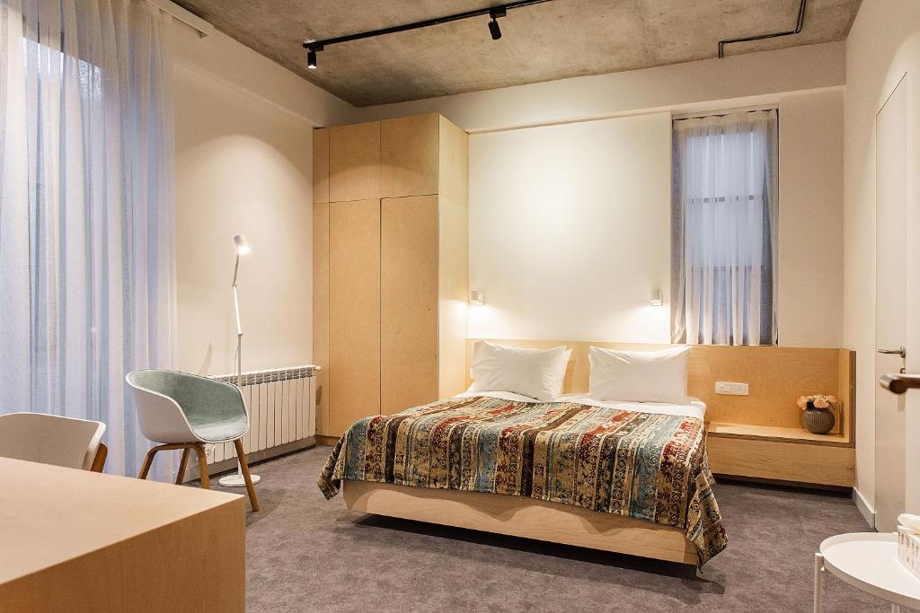 Postel nebo postele na pokoji v ubytování Dilijani Tun Hotel & Restaurant