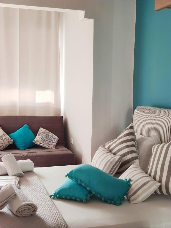 Postel nebo postele na pokoji v ubytování LEFKAS CITY APARTMENTS & Suites