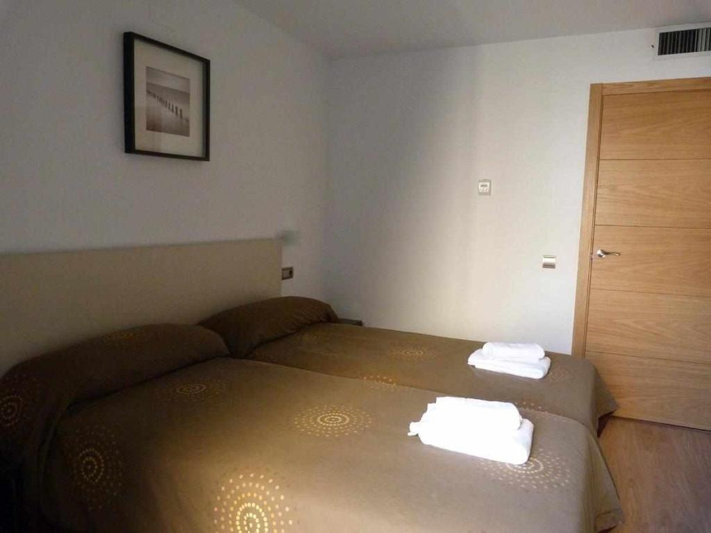 Cama o camas de una habitación en Apartamentos Puerta de Ordesa