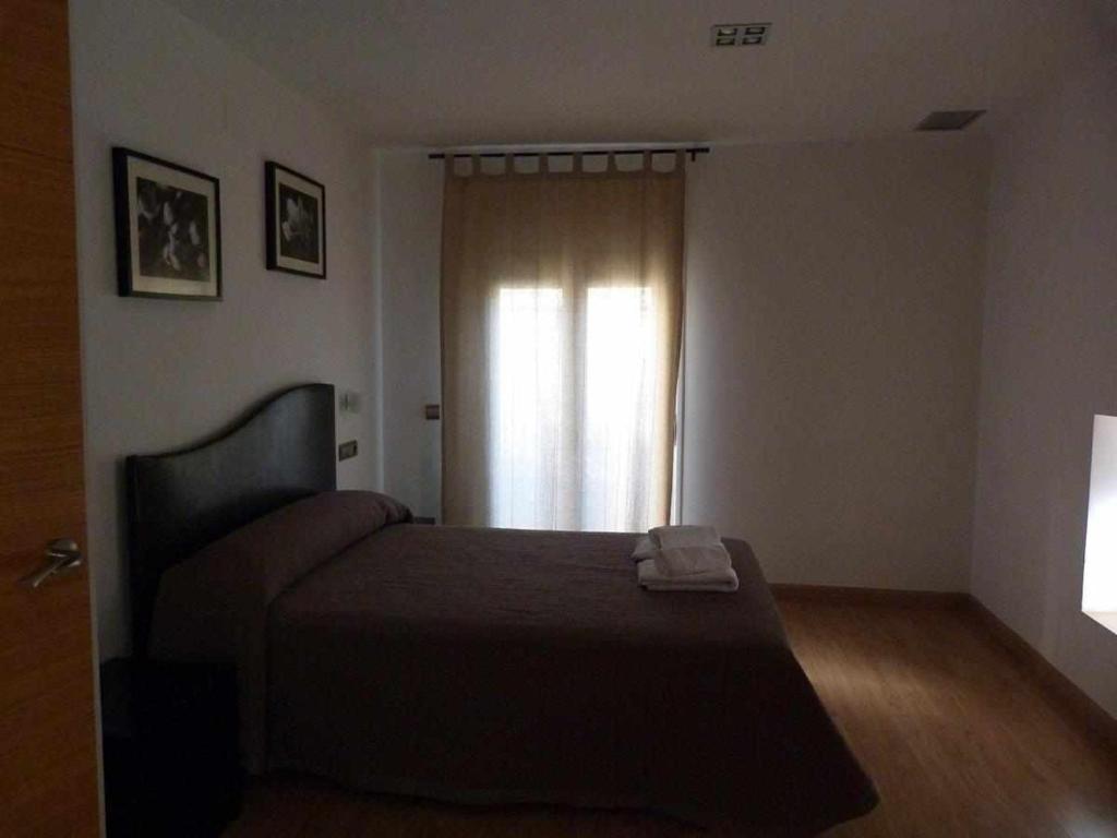 Cama o camas de una habitación en Apartamentos Puerta de Ordesa