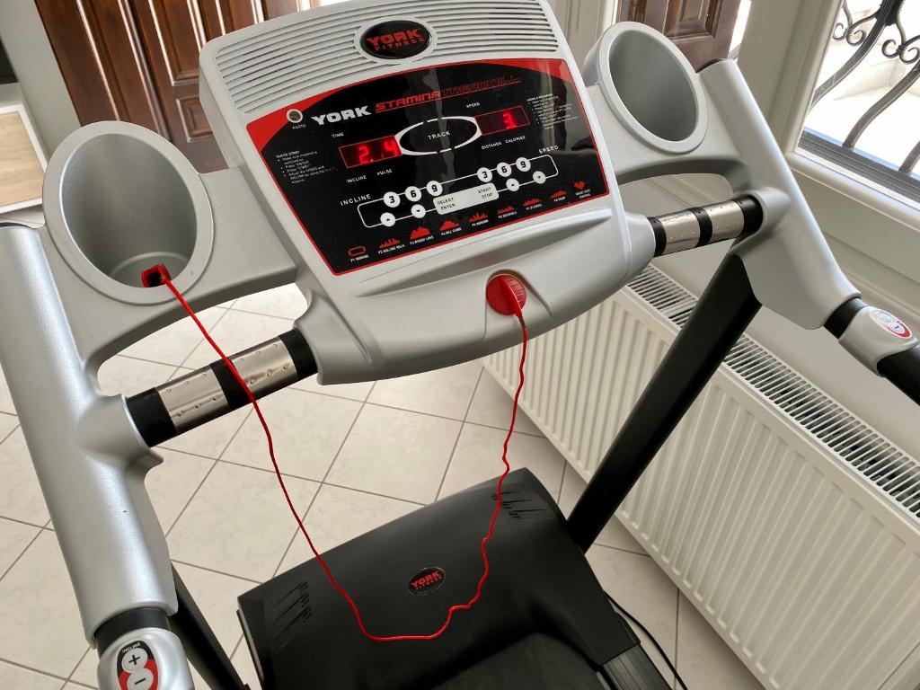 a treadmill with a screen on top of it at PORTA HOME modern and hospitable in Naxos Chora