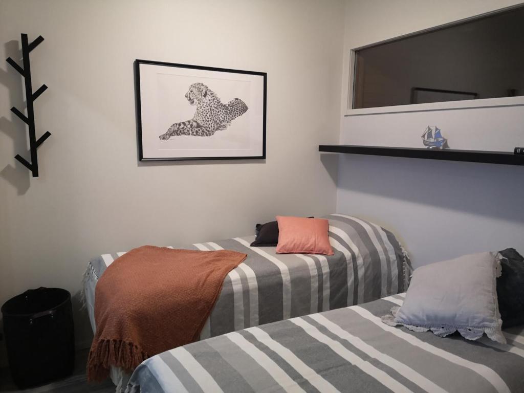 Postel nebo postele na pokoji v ubytování Aurinkoranta B4 merinäköalalla