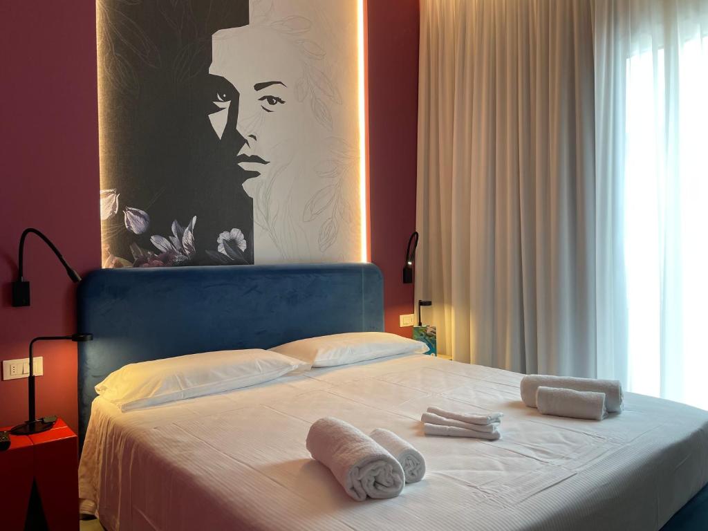 Postel nebo postele na pokoji v ubytování Hotel Iris Jesolo