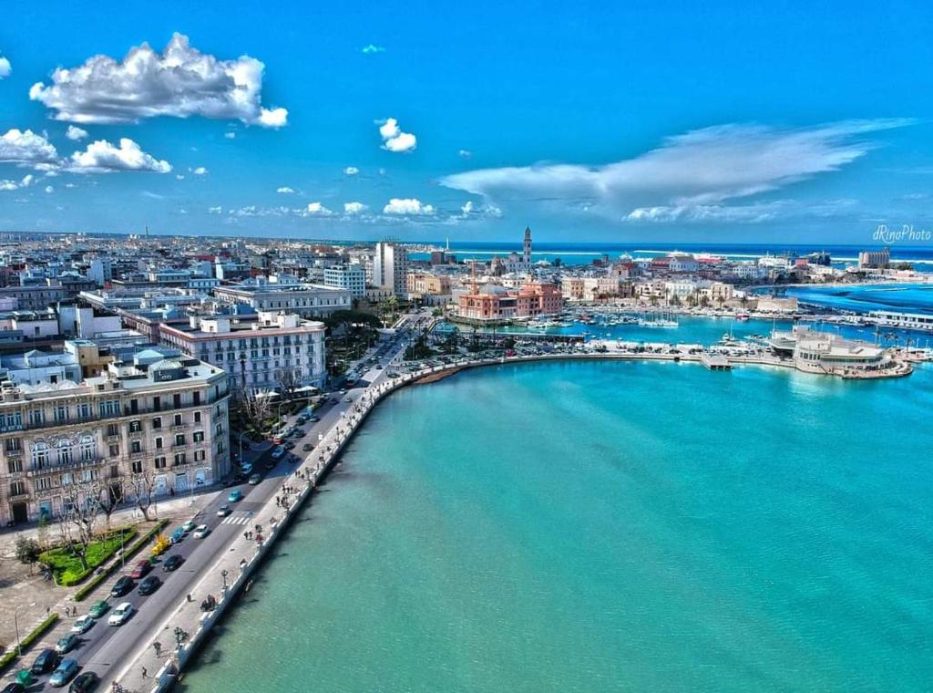 an aerial view of a city with a bridge over the water at Olimpia House - Central Station in Bari