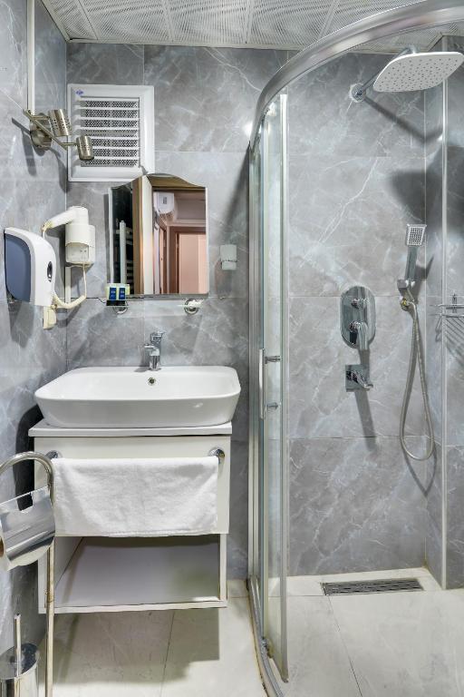 A bathroom at Grande Stella Hotel