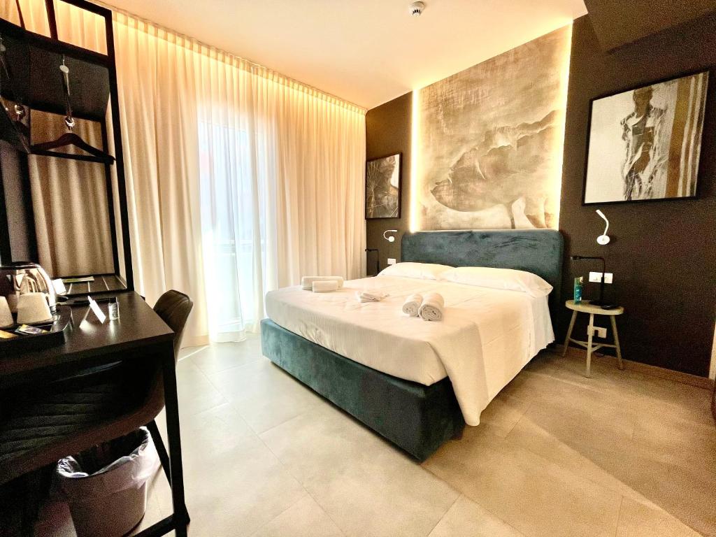 Postel nebo postele na pokoji v ubytování Hotel Iris Jesolo